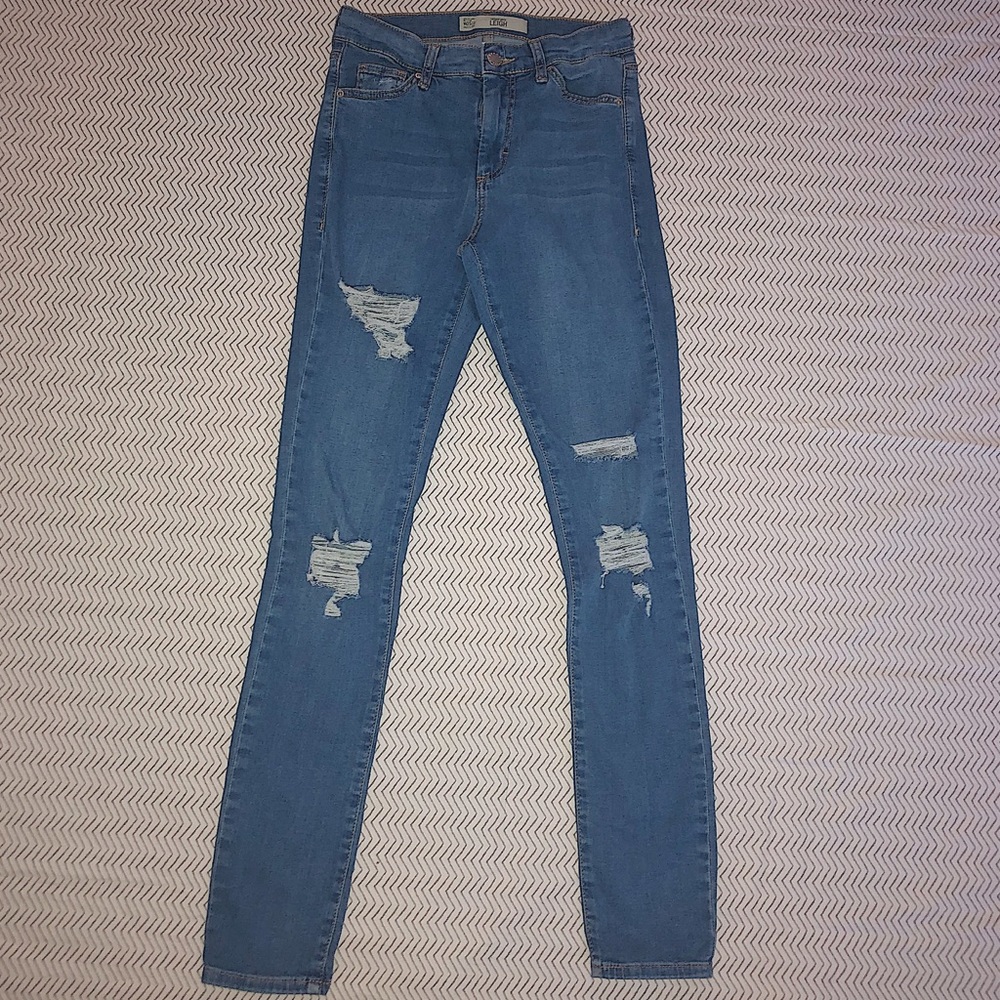 Topshop ripped jeans that have a stretchy fabric.